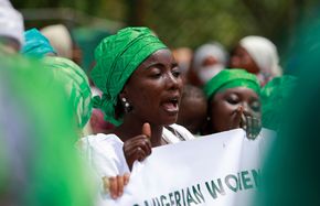 Abuja, March 8, 2022: A woman marches to protest against legislative bias against women on International Women's Day.